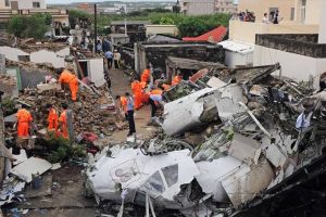 Debris of plane after it crashed are being cleared by volunteers.