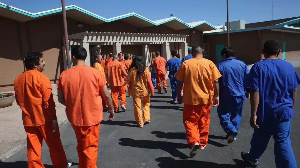 Immigrant detainees walk through the Immigration and Customs Enforcement (ICE), detention facility on February 28, 2013 in Florence, ArizonPhoto: John Moore (Getty Images)